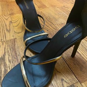 Black gold strapped BEBÉ heels!